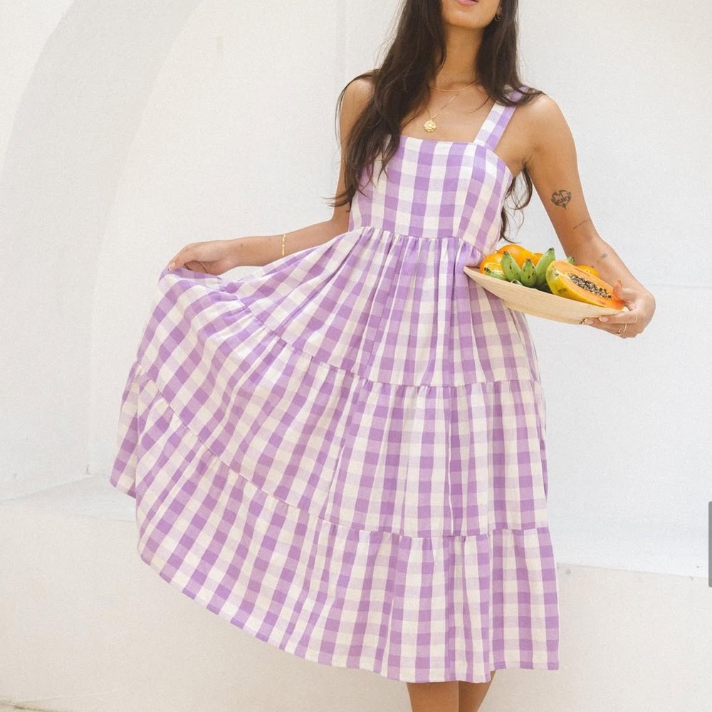 “Here & There Collective” The Montauk Midi Dress in
Lilac Gingham